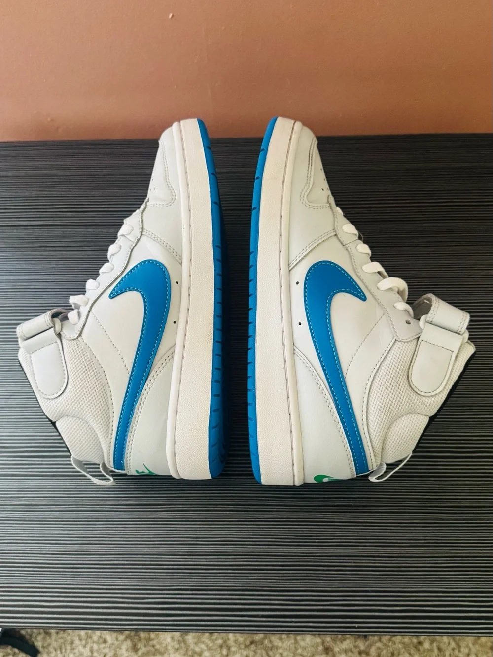 Nike White High-Top Sneakers with Blue Swoosh Accents